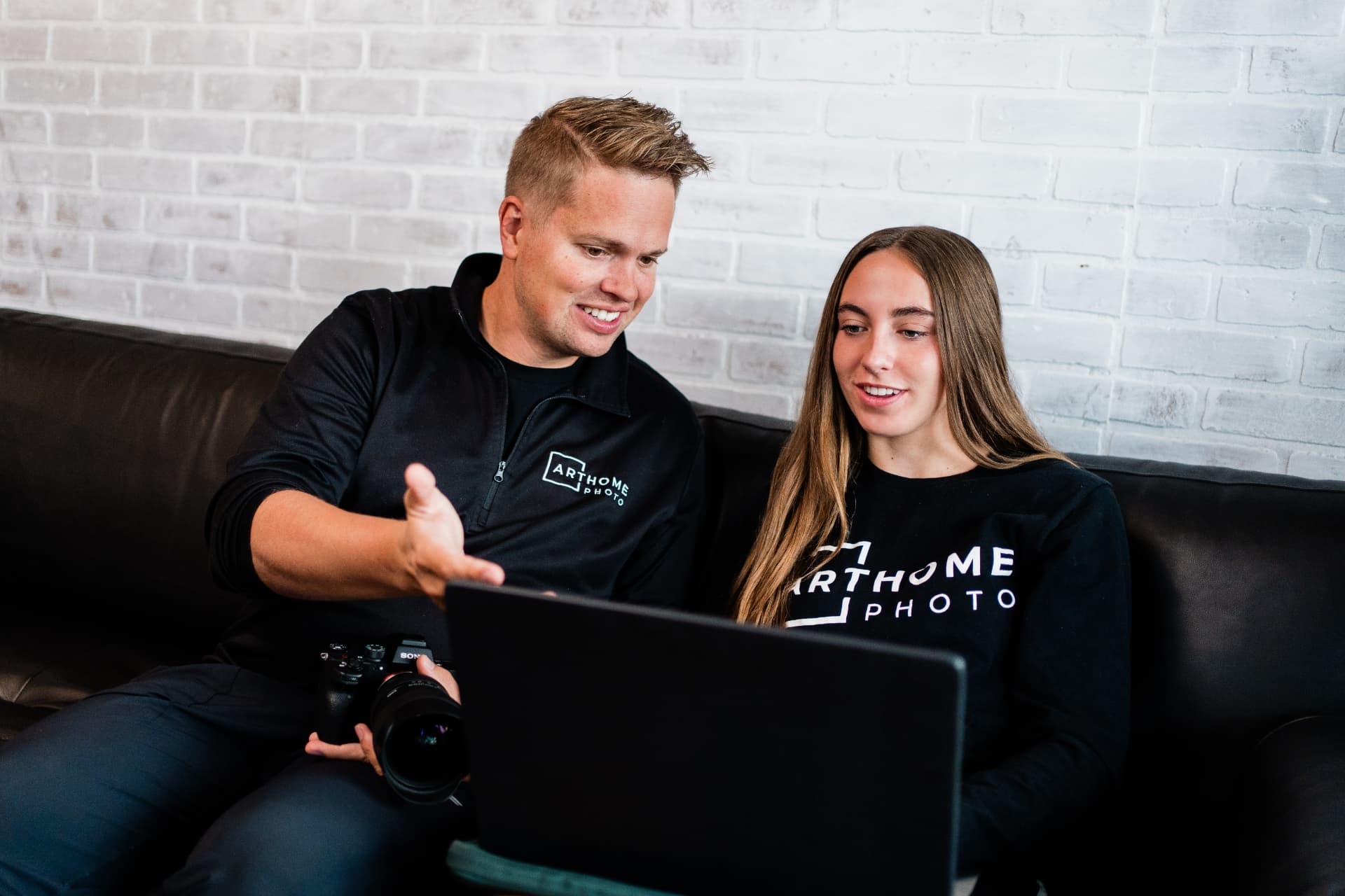 Dustin coaching a client on a laptop